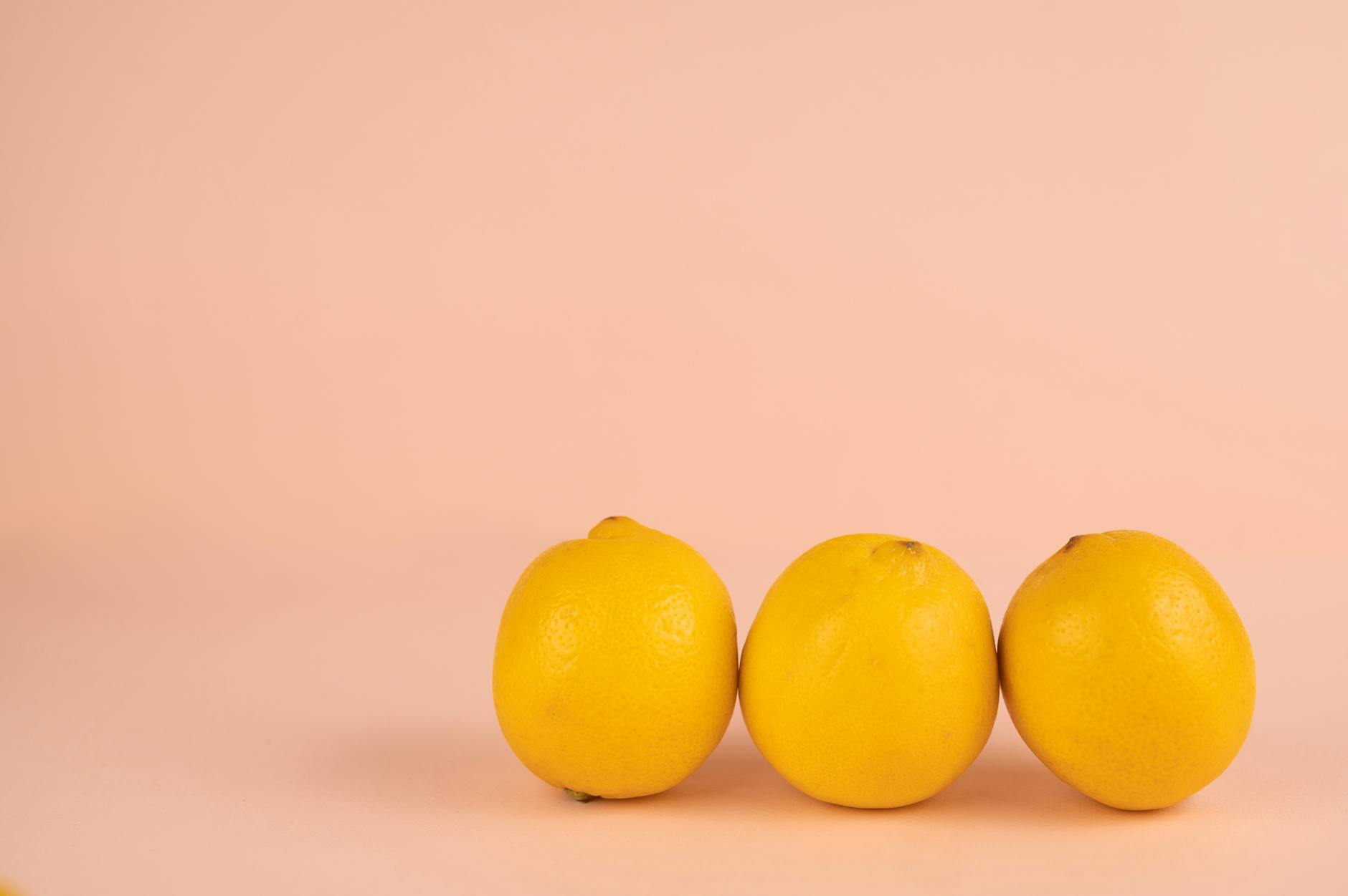 Fresh bright yellow lemons on a pastel background symbolizing renewal and regaining sensation